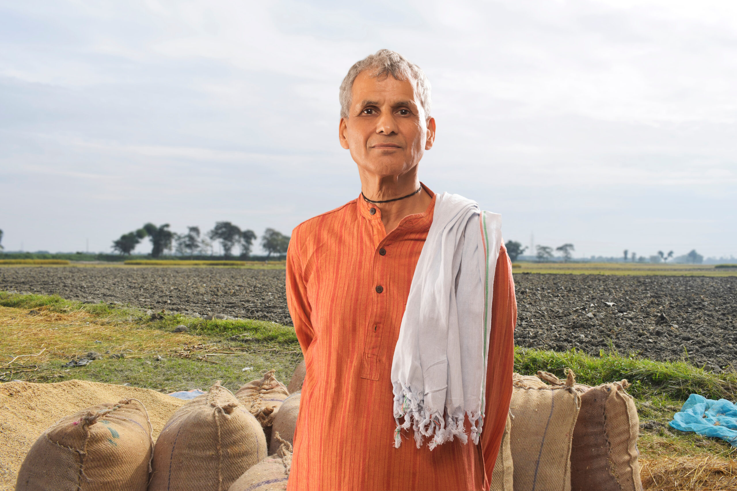 Portrait of a farmer standing in a paddy field