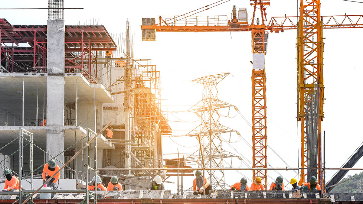 A large construction site with cranes and an unfinished structure