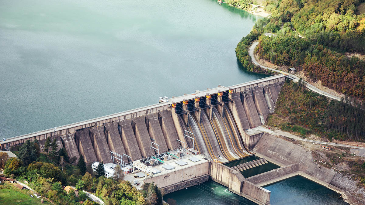 A large dam releasing water from a reservoir
