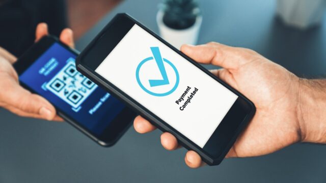 A customer scanning a QR code to make a digital payment