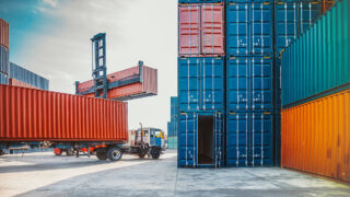Shipping containers being handled at a freight terminal